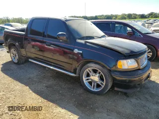 2002 Ford F-150 Harley Davidson with VIN 1FTRW07332KD46296, listed as a Copart auction lot 76333404 with 160,616 mi miles and Salvage Title. Bid and sale history available at carsss.com. Image 4.