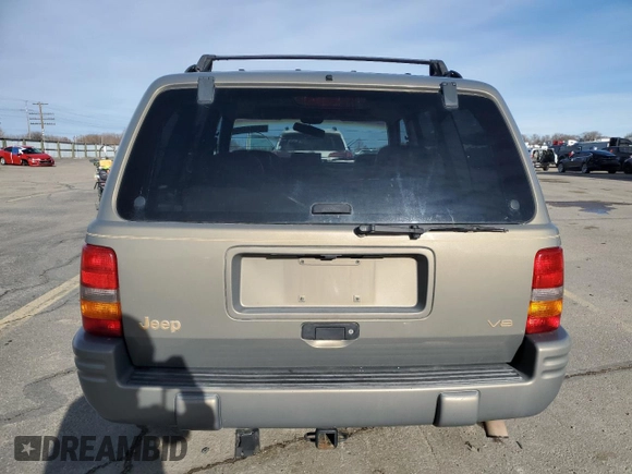 1997 Jeep Grand Cherokee Limited with VIN 1J4GZ78Y4VC754624, listed as a Copart auction lot 49884435 with 144,682 mi miles and Salvage Title. Bid and sale history available at carsss.com. Image 6.