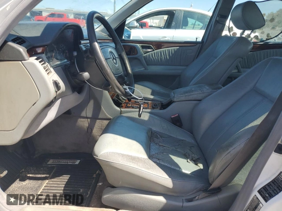 1999 Mercedes-Benz E-Class with VIN WDBJF65H0XA877630, listed as a Copart auction lot 69697454 with 0 mi miles and Salvage Title. Bid and sale history available at carsss.com. Image 7.