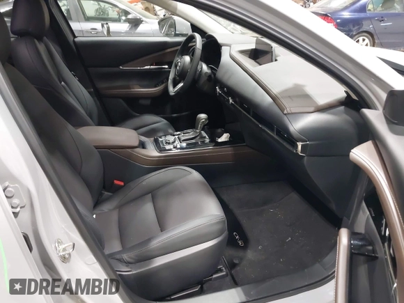 2025 Mazda CX-30 S Premium with VIN 3MVDMBDM5SM788786, listed as a IAAI auction lot 42126428 with 1,370 mi miles and . Bid and sale history available at DreamBid. Image 5.