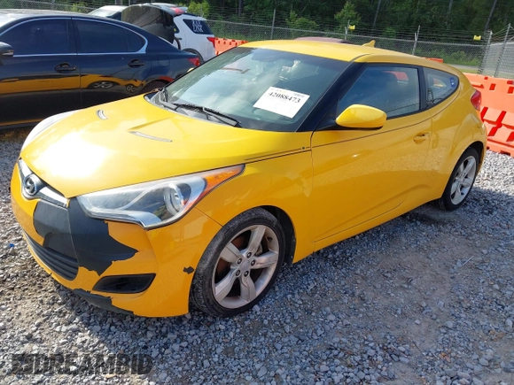 2012 Hyundai Veloster w/Gray Int z VIN KMHTC6AD2CU079902, wystawiony jako IAAI lot #42088473 z przebiegiem 143 983 mil mil oraz . Historia ofert i sprzedaży dostępna na DreamBid. Obrazek 2.