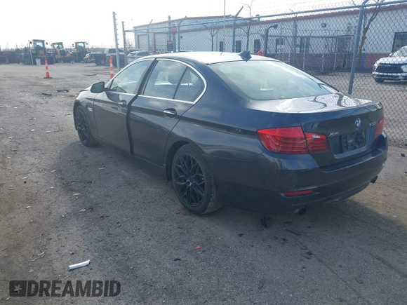 2014 BMW 5 Series 535i xDrive with VIN WBA5B3C52ED534784, listed as a IAAI auction lot 41875567 with 128,533 mi miles and . Bid and sale history available at carsss.com. Image 3.