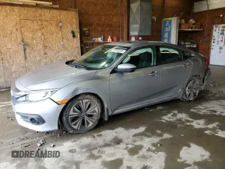 2016 Honda Civic EX-T z VIN 2HGFC1F33GH637755, wystawiony jako Copart lot #52940335 z przebiegiem 142 136 mil mil oraz Szkoda całkowita • Salvage title. Historia ofert i sprzedaży dostępna na DreamBid. Obrazek 1.
