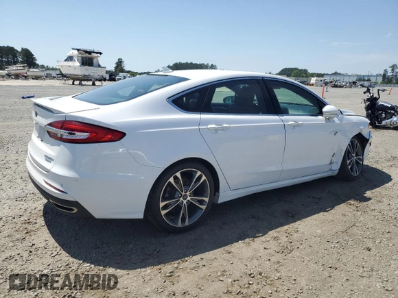 2020 Ford Fusion Titanium с VIN 3FA6P0K99LR174094, выставлен на аукционе Copart как лот 52583435 с пробегом 98 389 миль миль и Списание • Salvage title. История ставок и продаж доступна на DreamBid. Изображение 3.
