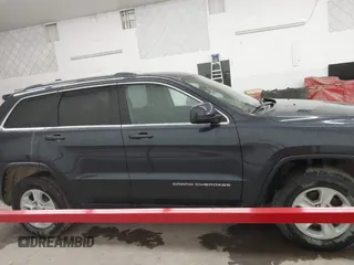 2014 Jeep Grand Cherokee Laredo with VIN 1C4RJFAG4EC186926, listed as a IAAI auction lot 41745168 with 128,519 mi miles. Bid and sale history available at carsss.com. Image 13.