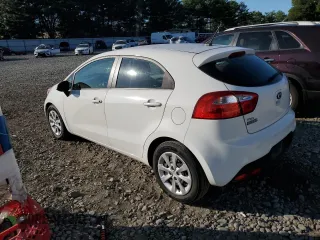 2014 Kia Rio EX with VIN KNADN5A37E6410739, listed as a Copart auction lot 70122594 with 60,177 mi miles and Salvage Title. Bid and sale history available at carsss.com. Image 2.