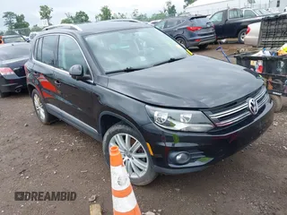 2014 Volkswagen Tiguan S with VIN WVGBV3AX1EW576722, listed as a IAAI auction lot 42631662 with 142,152 mi miles and . Bid and sale history available at DreamBid. Image 1.