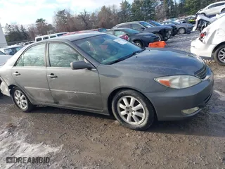 2003 Toyota Camry LE with VIN 4T1BE30K53U649007, listed as a IAAI auction lot 41030219 with 208,469 mi miles. Bid and sale history available at carsss.com. Image 13.