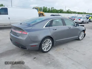 2014 Lincoln MKZ z VIN 3LN6L2G99ER834840, wystawiony jako IAAI lot #42134656 z przebiegiem 33 565 mil mil oraz . Historia ofert i sprzedaży dostępna na DreamBid. Obrazek 4.