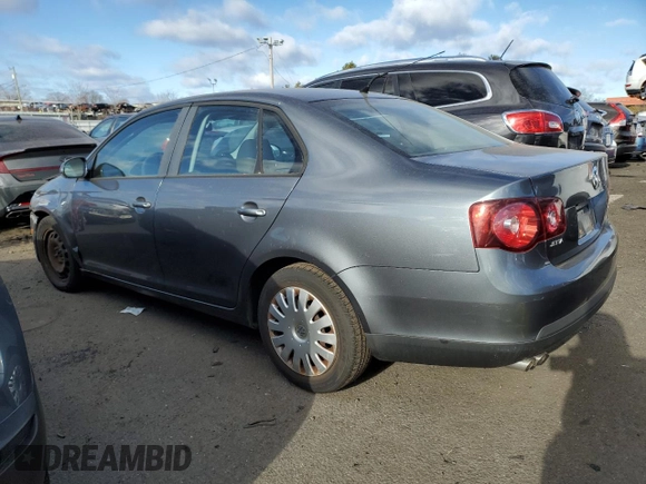 2009 Volkswagen Jetta z VIN 3VWHZ71KX9M011693, wystawiony jako Copart lot #87076904 z przebiegiem 157 478 mil mil oraz Szkoda całkowita • Salvage title. Historia ofert i sprzedaży dostępna na DreamBid. Obrazek 2.