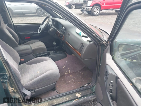 1996 Jeep Grand Cherokee Laredo with VIN 1J4GZ58S6TC333856, listed as a IAAI auction lot 42504895 with 176,955 mi miles and . Bid and sale history available at DreamBid. Image 5.