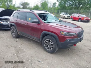 2020 Jeep Cherokee Trailhawk z VIN 1C4PJMBX8LD619813, wystawiony jako IAAI lot #42366066 z przebiegiem 69 811 mil mil oraz . Historia ofert i sprzedaży dostępna na DreamBid. Obrazek 1.