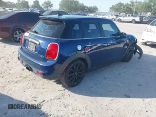 2016 MINI Cooper Hardtop 4 Door S with VIN WMWXU3C54G2D30766, listed as a IAAI auction lot 42008026 with 101,898 mi miles. Bid and sale history available at carsss.com. Image 4.