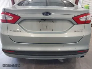 2013 Ford Fusion SE Hybrid with VIN 3FA6P0LUXDR355984, listed as a IAAI auction lot 41977367 with 244,310 mi miles. Bid and sale history available at carsss.com. Image 6.