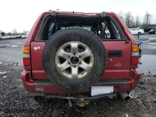 1998 Isuzu Rodeo S with VIN 4S2CM58W5W4350575, listed as a Copart auction lot 84537714 with 215,573 mi miles and Salvage Title. Bid and sale history available at carsss.com. Image 6.