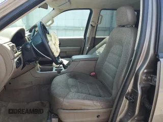 2003 Ford Explorer XLS with VIN 1FMZU72K43UB12036, listed as a Copart auction lot 61124985 with 210,901 mi miles and Salvage title. Bid and sale history available at DreamBid. Image 7.
