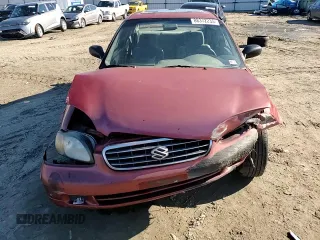 2001 Suzuki Esteem GL z VIN JS2GB41S915202412, wystawiony jako Copart lot #88372235 z przebiegiem 301 061 mil mil oraz Szkoda całkowita • Salvage title. Historia ofert i sprzedaży dostępna na DreamBid. Obrazek 10.