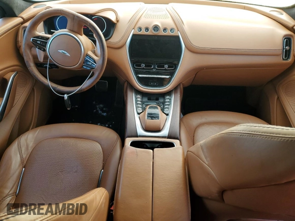 2021 Aston Martin DBX z VIN SCFVUJAW9MTV02708, wystawiony jako Copart lot #85731374 z przebiegiem Nie podano mil oraz Szkoda całkowita • Salvage title. Historia ofert i sprzedaży dostępna na DreamBid. Obrazek 8.