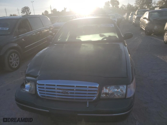 2000 Ford Crown Victoria LX with VIN 2FAFP74W9YX146624, listed as a Copart auction lot 77495074 with 167,594 mi miles and Salvage Title. Bid and sale history available at carsss.com. Image 5.