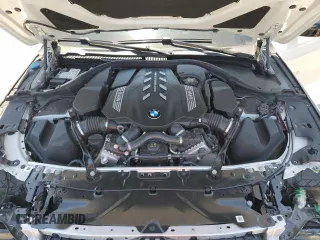2020 BMW 8 Series M850i xDrive z VIN WBABC4C00LCE77534, wystawiony jako Copart lot #57640795 z przebiegiem Nie podano mil oraz Szkody całkowita. Historia ofert i sprzedaży dostępna na DreamBid. Obrazek 11.
