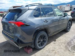 2022 Toyota RAV4 Hybrid SE with VIN JTM16RFV0ND070012, listed as a IAAI auction lot 42244604 with 22,740 mi miles and . Bid and sale history available at DreamBid. Image 4.