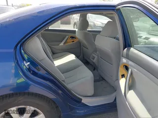 2007 Toyota Camry CE with VIN JTNBE46K373056707, listed as a IAAI auction lot 42128026 with 242,887 mi miles. Bid and sale history available at carsss.com. Image 8.