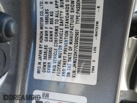 2012 Honda Insight EX z VIN JHMZE2H77CS002907, wystawiony jako Copart lot #52040465 z przebiegiem 158 266 mil mil oraz Szkoda całkowita • Salvage title. Historia ofert i sprzedaży dostępna na DreamBid. Obrazek 14.