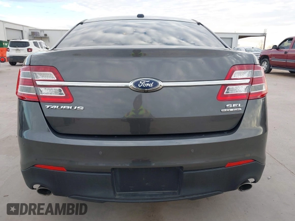 2017 Ford Taurus SEL z VIN 1FAHP2E80HG129843, wystawiony jako IAAI lot #41252910 z przebiegiem 111 923 mil mil oraz . Historia ofert i sprzedaży dostępna na DreamBid. Obrazek 16.