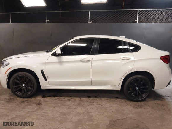 2019 BMW X6 sDrive35i with VIN 5UXKU0C5XK0S97686, listed as a IAAI auction lot 40436492 with 105,584 mi miles. Bid and sale history available at carsss.com. Image 14.