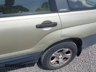 2003 Subaru Forester X with VIN JF1SG63673H741605, listed as a IAAI auction lot 42565708 with 194,796 mi miles and . Bid and sale history available at DreamBid. Image 6.