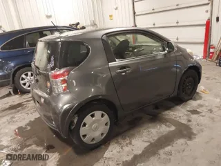 2012 Scion iQ with VIN JTNJJXB03CJ019403, listed as a IAAI auction lot 41543384 with 110,749 mi miles. Bid and sale history available at carsss.com. Image 4.