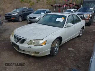 2001 Mazda Millenia z VIN JM1TA221211708077, wystawiony jako IAAI lot #41517393 z przebiegiem 269 771 mil mil oraz . Historia ofert i sprzedaży dostępna na DreamBid. Obrazek 2.