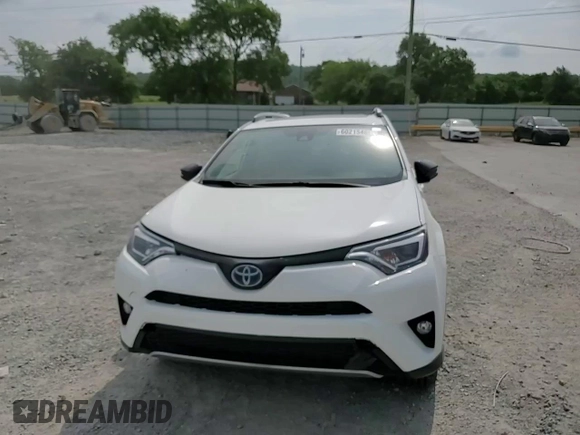 2018 Toyota RAV4 Hybrid SE with VIN JTMJJREVXJD212926, listed as a Copart auction lot 60215465 with 71,876 mi miles and Salvage title. Bid and sale history available at DreamBid. Image 14.
