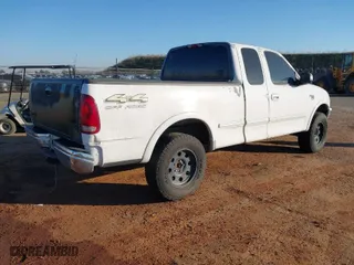 1998 Ford F-150 Standard with VIN 1FTZX18W4WKB71994, listed as a IAAI auction lot 41450074 with 202,784 mi miles. Bid and sale history available at carsss.com. Image 4.