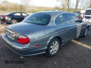 2003 Jaguar S-Type with VIN SAJEA01T23FM93839, listed as a IAAI auction lot 41891973 with 153,761 mi miles and . Bid and sale history available at DreamBid. Image 4.