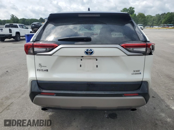 2022 Toyota RAV4 Hybrid XSE with VIN 2T3E6RFVXNW031612, listed as a Copart auction lot 60544055 with 99,831 mi miles and Salvage title. Bid and sale history available at DreamBid. Image 6.