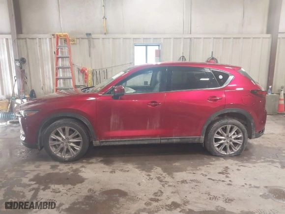2021 Mazda CX-5 Grand Touring with VIN JM3KFBDMXM1430321, listed as a IAAI auction lot 41622134 with 44,955 mi miles. Bid and sale history available at carsss.com. Image 14.