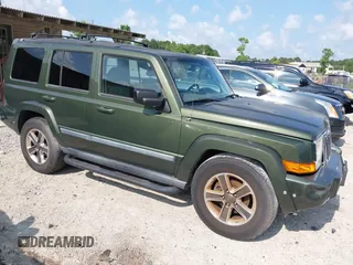 2007 Jeep Commander Sport z VIN 1J8HH48P57C699969, wystawiony jako IAAI lot #42387743 z przebiegiem 199 043 mil mil oraz . Historia ofert i sprzedaży dostępna na DreamBid. Obrazek 1.