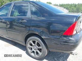 2004 Ford Focus SE z VIN 1FAFP34Z54W175689, wystawiony jako IAAI lot #42553615 z przebiegiem 188 652 mil mil oraz . Historia ofert i sprzedaży dostępna na DreamBid. Obrazek 6.