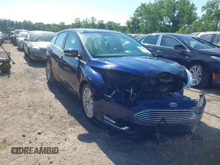 2016 Ford Focus Titanium with VIN 1FADP3N23GL231613, listed as a IAAI auction lot 42645683 with 76,072 mi miles and . Bid and sale history available at DreamBid. Image 1.