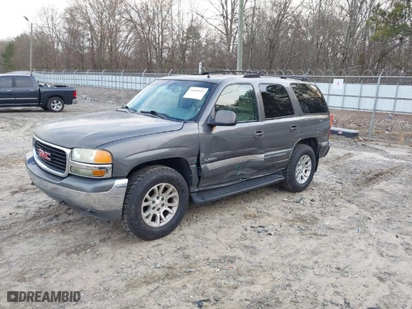 2002 GMC Yukon SLT with VIN 1GKEC13ZX2J217778, listed as a IAAI auction lot 41469912 with 293,497 mi miles. Bid and sale history available at carsss.com. Image 2.