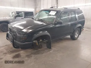 2000 Ford Explorer z VIN 1FMYU60X2YUA61809, wystawiony jako IAAI lot #42414796 z przebiegiem 167 129 mil mil oraz . Historia ofert i sprzedaży dostępna na DreamBid. Obrazek 2.