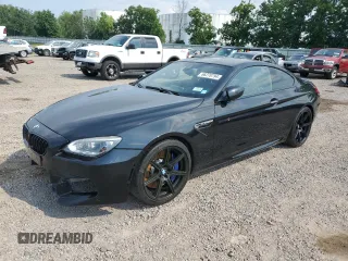 2014 BMW M6 z VIN WBSLX9C54ED160430, wystawiony jako Copart lot #66270794 z przebiegiem 92 025 mil mil oraz Szkody całkowita. Historia ofert i sprzedaży dostępna na DreamBid. Obrazek 1.