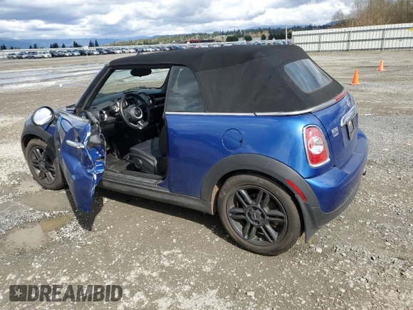 2014 MINI Convertible with VIN WMWZN3C55ET861078, listed as a Copart auction lot 50240665 with 50,541 mi miles and Salvage Title. Bid and sale history available at DreamBid. Image 2.