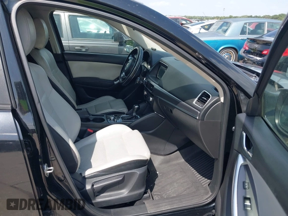 2016 Mazda CX-5 Grand Touring z VIN JM3KE2DY2G0765444, wystawiony jako IAAI lot #42527577 z przebiegiem 162 871 mil mil oraz . Historia ofert i sprzedaży dostępna na DreamBid. Obrazek 5.