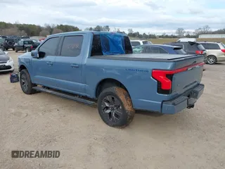 2023 Ford F-150 Lightning Pro with VIN 1FT6W1EVXPWG34958, listed as a IAAI auction lot 41732898 with 10,573 mi miles and . Bid and sale history available at DreamBid. Image 3.