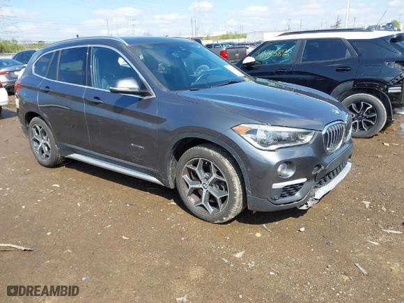 2016 BMW X1 xDrive28i with VIN WBXHT3C35GP886094, listed as a IAAI auction lot 42009639 with 61,739 mi miles. Bid and sale history available at carsss.com. Image 1.
