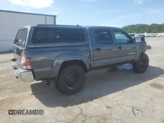 2014 Toyota Tacoma with VIN 3TMLU4EN2EM163797, listed as a Copart auction lot 61078805 with 130,748 mi miles and Salvage title. Bid and sale history available at DreamBid. Image 3.