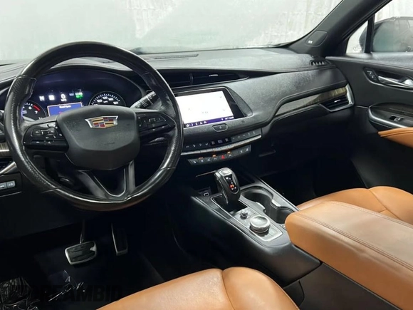 2019 Cadillac XT4 AWD Sport с VIN 1GYFZFR49KF139367, выставлен на аукционе Copart как лот 66960735 с пробегом 83 326 миль миль и Чистый • Clean title. История ставок и продаж доступна на DreamBid. Изображение 9.