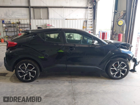 2020 Toyota C-HR LE with VIN JTNKHMBX1L1077957, listed as a IAAI auction lot 42159765 with 83,138 mi miles and . Bid and sale history available at DreamBid. Image 14.